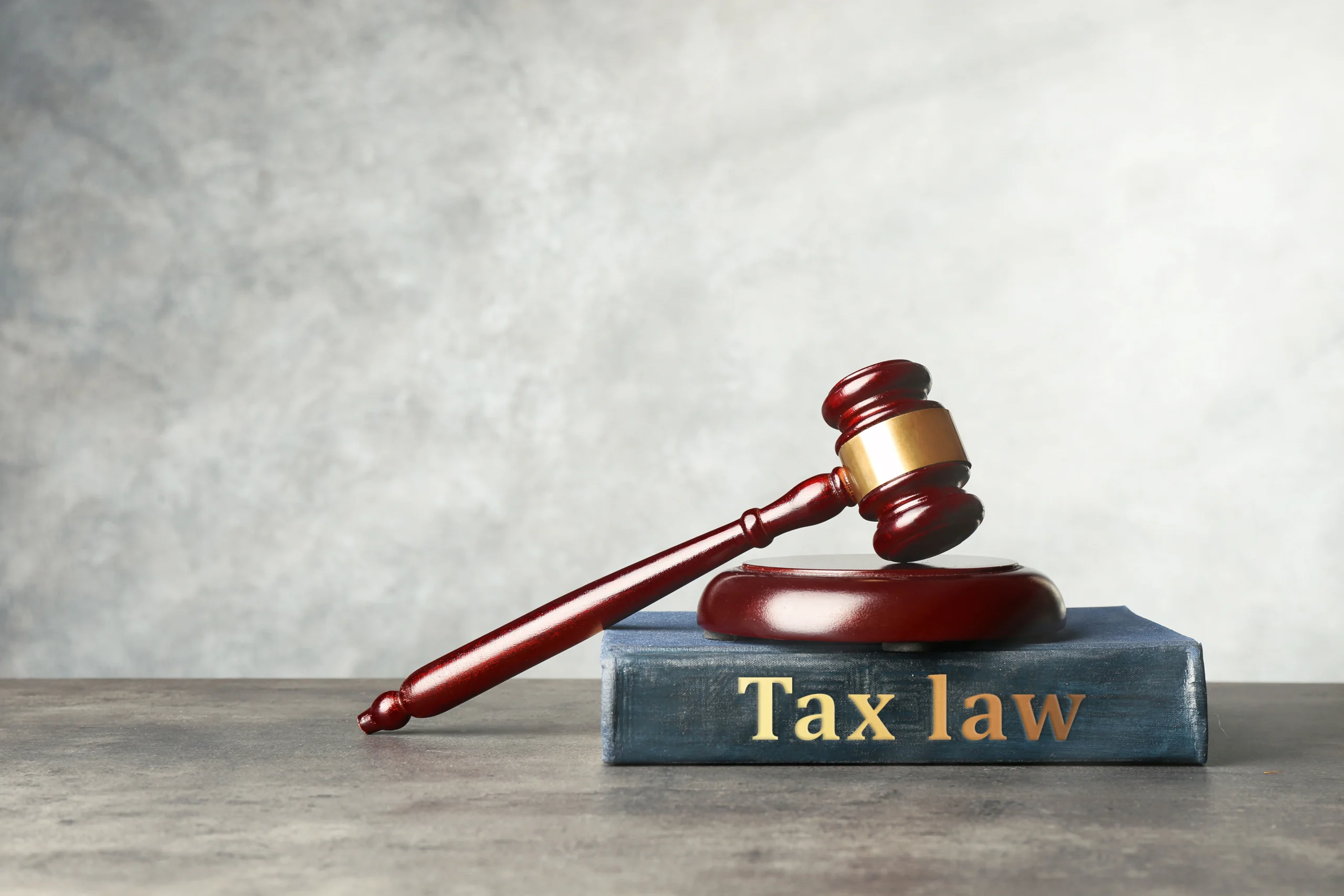 Justice gavel sits on top of a Tax Law book. If you’re being audited by the IRS and looking for tax law expertise, contact our experienced tax attorney in San Antonio or Austin.