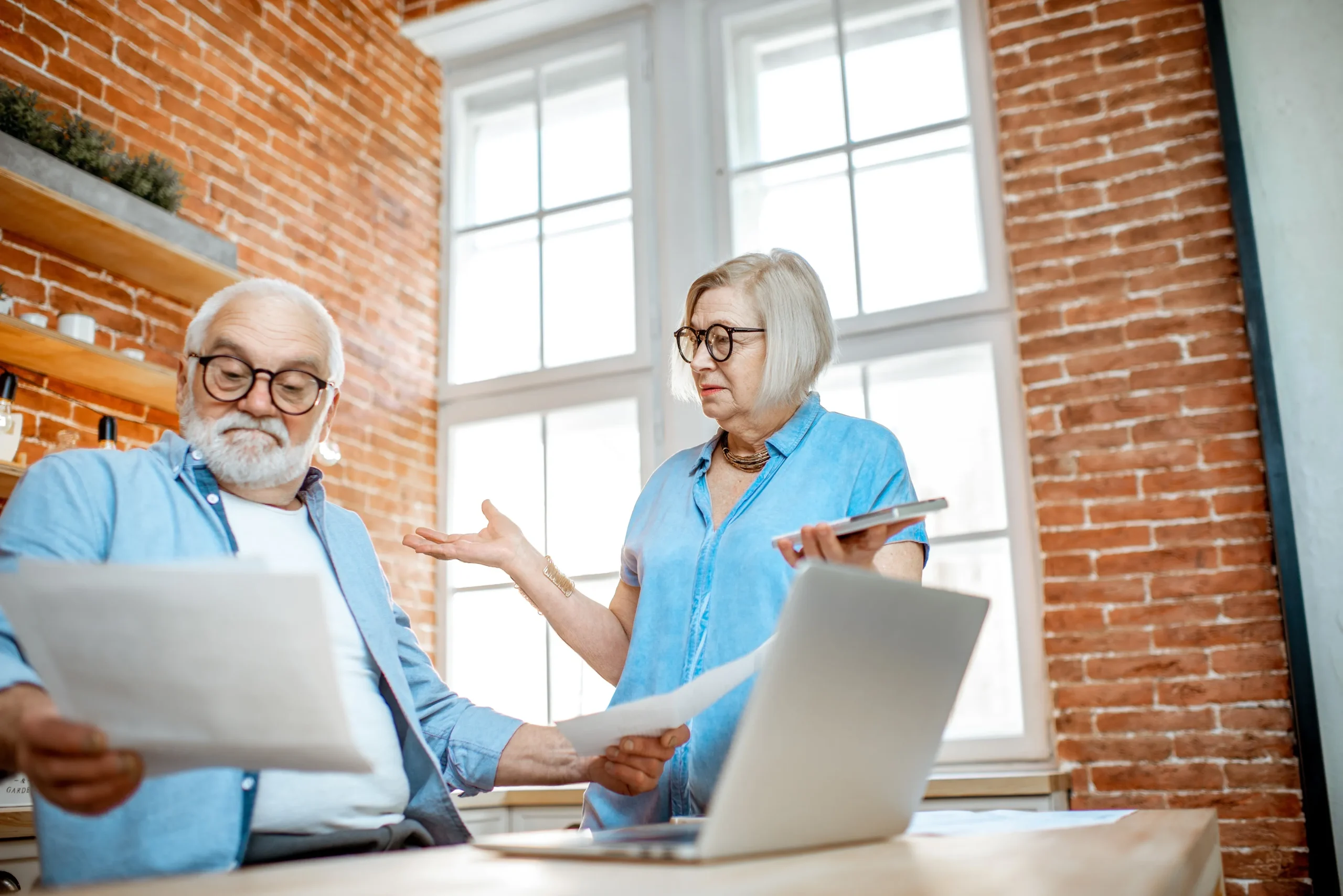 A man and woman arguing about taxes.