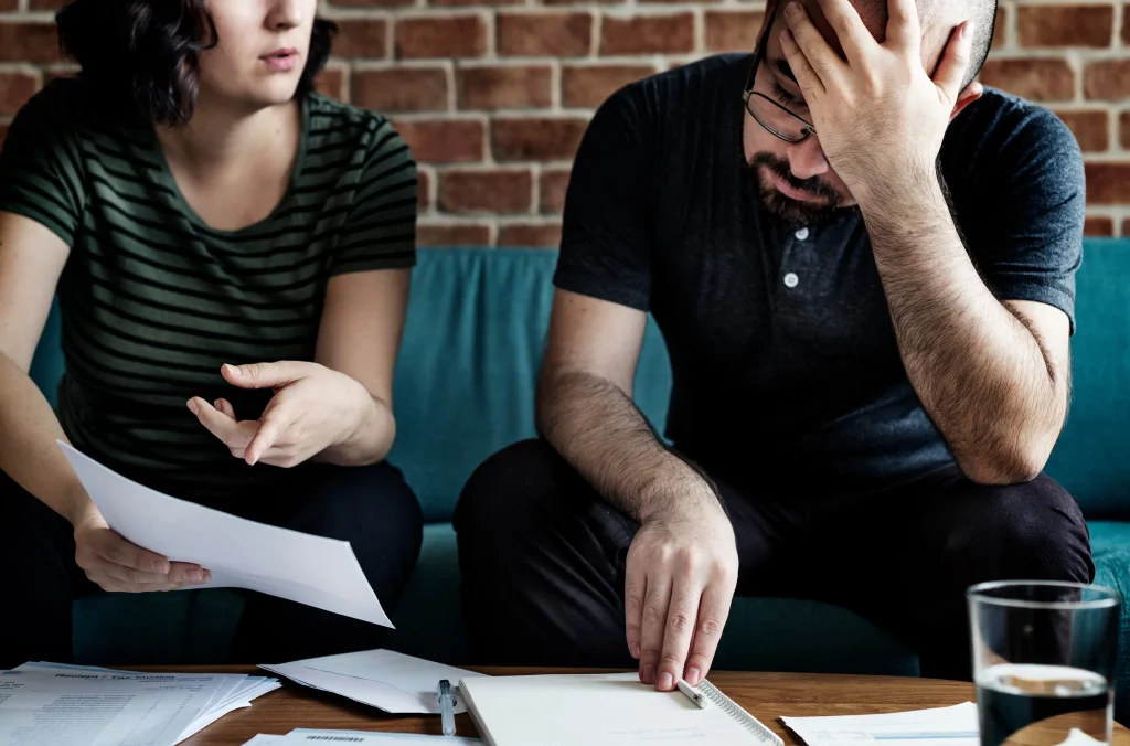 A couple stressing out over tax documents.