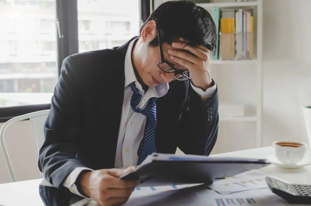 A business man looking at a tax letter.