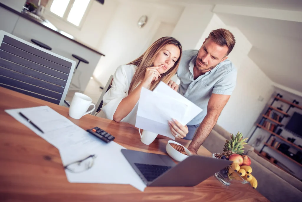 A couple looking at paperwork.